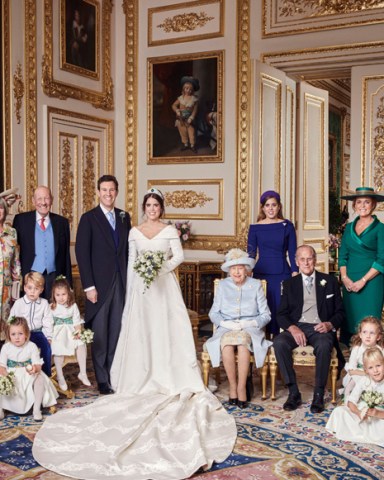 Free for Editorial Use Only. See terms of release, which must be included and passed-on to anyone to whom this image is suppliedMandatory Credit: Photo by Alex Bramall/PA Wire/REX/Shutterstock (9930686d)This official wedding photograph released by the Royal Communications of Princess Eugenie and Mr Brooksbank, shows - Princess Eugenie and Jack Brooksbank in the White Drawing Room, Windsor Castle with (left to right) Back row: Mr Thomas Brooksbank ; Mrs Nicola Brooksbank; Mr George Brooksbank; Her Royal Highness Princess Beatrice of York; Sarah, Duchess of York; His Royal Highness The Prince Andrew. Middle row: His Royal Highness Prince George ; Her Royal Highness Princess Charlotte ; Queen Elizabeth II ; His Royal Highness Prince Philip ; Miss Maud Windsor ; Master Louis de Givenchy ; Front row: Miss Theodora Williams ; Miss Mia Grace Tindall ; Miss Isla Phillips ; Miss Savannah Phillips.The Wedding of Princess Eugenie and Jack Brooksbank, Official Portraits, Windsor, Berkshire, UK - 12 Oct 2018News Editorial Use Only. No Commercial Use. No Merchandising, Advertising, Souvenirs, Memorabilia or Colourably Similar. Not for use after 30th April 2019 without prior permission from Buckingham Palace. No Cropping. Copyright in the photograph is vested in Princess Eugenie of York and Mr Jack Brooksbank and Alex Bramall. Publications are asked to credit the photograph to Alex Bramall. No charge should be made for the supply, release or publication of the photograph. The photograph must not be digitally enhanced, manipulated or modified in any manner or form and must include all of the individuals in the photograph when published.
