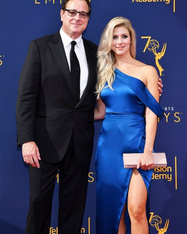 Bob Saget, Kelly Rizzo. Bob Saget, left, and Kelly Rizzo arrive at night one of the Television Academy's 2018 Creative Arts Emmy Awards at the Microsoft Theater, in Los AngelesTelevision Academy's 2018 Creative Arts Emmy Awards - Arrivals - Night One, Los Angeles, USA - 08 Sep 2018