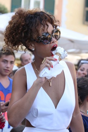 Rihanna enjoys an ice cream with friends and fans in Porto Fino Italy, and takes pictures of the photographers shooting her.Pictured: RihannaRef: SPL308775 240811 NON-EXCLUSIVEPicture by: SplashNews.comSplash News and PicturesLos Angeles: 310-821-2666New York: 212-619-2666London: 0207 644 7656Milan: +39 02 4399 8577Sydney: +61 02 9240 7700photodesk@splashnews.comWorld Rights