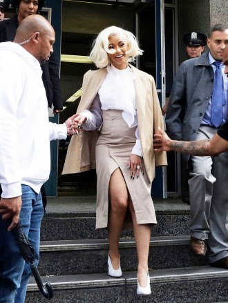 Rapper Cardi B is assisted by security guards as she leaves a police precinct, in the Queens borough of New York. The rapper met with police as part of an investigation of her possible involvement in a fight at a strip club
Cardi B Strip Club Fracas, New York, USA - 01 Oct 2018