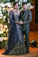 Newlyweds, Bollywood actress Priyanka Chopra (L) and US musician Nick Jonas (R) pose for photographs during a reception in Mumbai, India, 19 December 2018.Priyanka Chopra and Nick Jonas reception in Mumbai, India - 19 Dec 2018