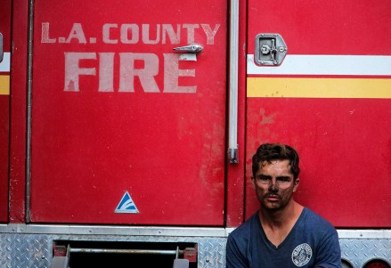 Los Angeles County Firefighter Collin Bashara takes rest with his fire truck in Los Angeles
California Wildfires, Los Angeles, USA - 28 Oct 2019