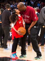Los Angeles Lakers' Kobe Bryant (24) kisses his daughter the first half of the NBA all-star basketball game, Sunday, Feb. 14, 2016 in Toronto. (Mark Blinch/The Canadian Press via AP) MANDATORY CREDIT