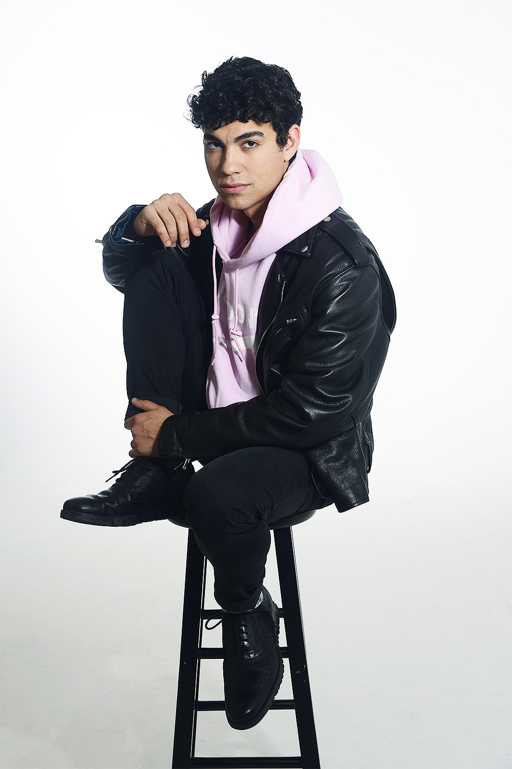 Davi Santos poses for a portrait for HollywoodLife.