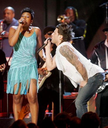Fantasia and Devin Lima perform "If You Want Me to Stay" during a special tribute to legendary funk band Sly and the Family Stone at the 48th Annual Grammy Awards on Wednesday, Feb. 8, 2006, in Los Angeles. (AP Photo/Mark J. Terrill)