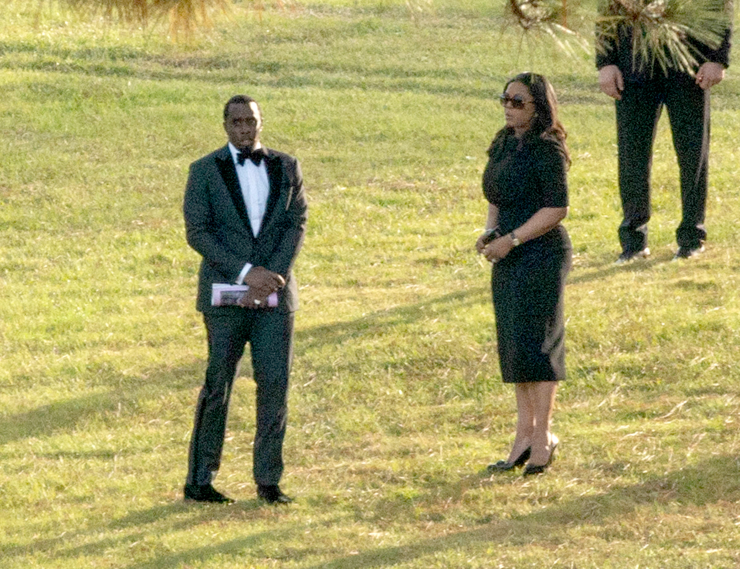 Emotional Sean 'Diddy' Combs takes a quiet moment ahead of burial for beloved ex Kim Porter.