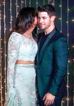 Bollywood actress Priyanka Chopra and musician Nick Jonas pose for photographs at their wedding reception in Mumbai, India
Chopra Jonas Wedding, Mumbai, India - 20 Dec 2018