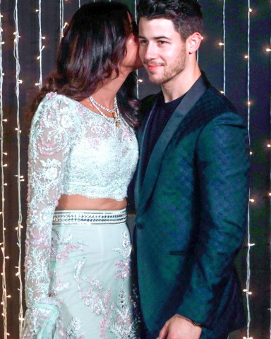 Bollywood actress Priyanka Chopra and musician Nick Jonas pose for photographs at their wedding reception in Mumbai, India Chopra Jonas Wedding, Mumbai, India - 20 Dec 2018