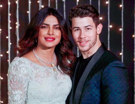 Bollywood actress Priyanka Chopra and musician Nick Jonas stand for photographs at their wedding reception in Mumbai, India
Chopra Jonas Wedding, Mumbai, India - 20 Dec 2018