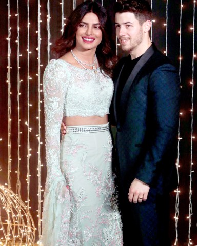 Bollywood actress Priyanka Chopra and musician Nick Jonas pose for photographs at their wedding reception in Mumbai, India
Chopra Jonas Wedding, Mumbai, India - 20 Dec 2018