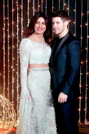 Bollywood actress Priyanka Chopra and musician Nick Jonas pose for photographs at their wedding reception in Mumbai, India
Chopra Jonas Wedding, Mumbai, India - 20 Dec 2018