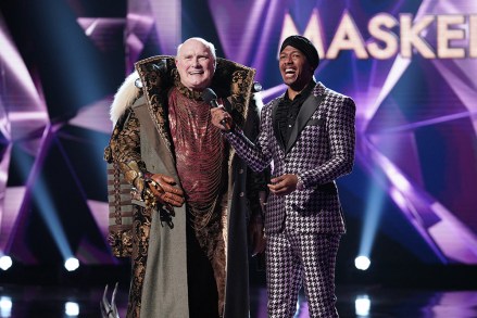 THE MASKED SINGER: L-R: Terry Bradshaw and host Nick Cannon in the all-new “Five Masks No More” episode of THE MASKED SINGER airing Wednesday, Jan. 16 (9:00-10:00 PM ET/PT) on FOX. © 2019 FOX Broadcasting. CR: Michael Becker / FOX.