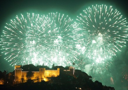 Fireworks light the sky marking New Year, behind Lisbon's Saint George castle in the first minutes ofNew Year, Lisbon, Portugal - 01 Jan 2019