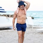 Andy Cohen shirtless on the beach with his son, Benjamin in Miami