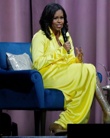 Former first lady Michelle Obama speaks as she is interviewed by Sarah Jessica Parker during an appearance for her book, "Becoming: An Intimate Conversation with Michelle Obama" at Barclays Center, in New York
Michelle Obama Book Tour, New York, USA - 19 Dec 2018