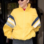 Kendall Jenner's smile is as bright as her yellow jacket leaving her Paris hotel