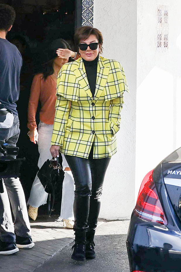 Hilary Duff wears a flannel shirt and leggings while stepping out