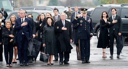 Former President George W. Bush and Laura Bush watch as the flag-draped casket of former US President George H.W. Bush is carried by a joint services military honor guard to a Union Pacific train in Spring, Texas, USA, 06 December 2018. At left is Columba Bush and her husband Jeb Bush and at far right is Barbara Bush and her husband Craig Coyne. Army Maj. Gen. Michael L. Howard, commanding general, Joint Task Force-National Capital Region salutes. Bush died at the age of 94 on 30 November 2018 at his home in Texas. George H.W. Bush was the 41st President of the United States (1989-1993).George H.W. Bush dies at age 94, Houston, Usa - 06 Dec 2018