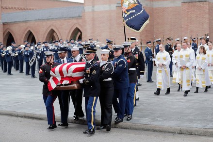 A military honor guard carries the flag-draped casket of former President George H.W. Bush from St. Martin's Episcopal Church following his funeral service, in HoustonGeorge HW Bush, Houston, USA - 06 Dec 2018