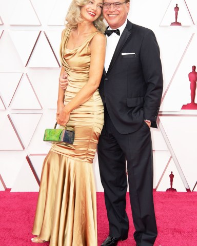 FOR EDITORIAL USE ONLY. No marketing or advertising is permitted without the prior consent of A.M.P.A.S.Mandatory Credit: Photo by Matt Petit/A.M.P.A.S./Shutterstock (11875500tj)Aaron Sorkin (L) and Paulina Porizkova arrive on the red carpet of The 93rd Oscars® at Union Station in Los Angeles, CA on Sunday, April 25, 2021.93rd Annual Academy Awards, Arrivals, Los Angeles, USA - 25 Apr 2021