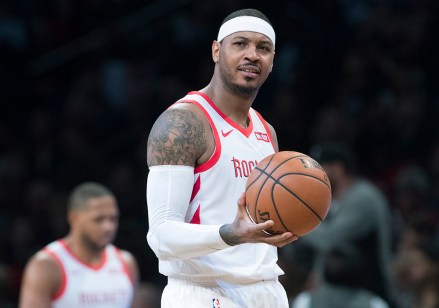 FILE - In this Nov. 2, 2018, file photo, Houston Rockets forward Carmelo Anthony reacts during the second half of the team's NBA basketball game against the Brooklyn Nets in New York. The Rockets won 119-111. The addition of Anthony to the Rockets‚Äô roster produced more thorns than fruit and now he is out. (AP Photo/Mary Altaffer, File)