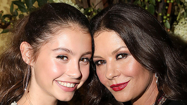 Catherine Zeta-Jones, 49, joined by Michael Douglas, 74, and daughter Carys  at Michael Kors NYFW