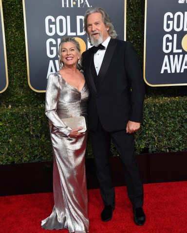 Jeff Bridges, right, and Susan Geston arrive at the 76th annual Golden Globe Awards at the Beverly Hilton Hotel on Sunday, Jan. 6, 2019, in Beverly Hills, Calif. (Photo by Jordan Strauss/Invision/AP)