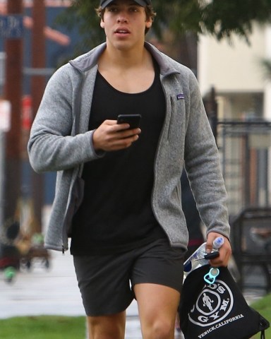 Venice, CA  - *EXCLUSIVE* - Arnold Schwarzenegger's son Joseph Baena is seen leaving the Gold's Gym after a morning workout in Venice. Joseph checked his phone for messages as he headed to the car.Pictured: Joseph BaenaBACKGRID USA 16 JANUARY 2019 USA: +1 310 798 9111 / usasales@backgrid.comUK: +44 208 344 2007 / uksales@backgrid.com*UK Clients - Pictures Containing ChildrenPlease Pixelate Face Prior To Publication*