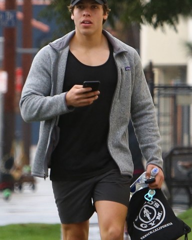 Venice, CA  - *EXCLUSIVE* - Arnold Schwarzenegger's son Joseph Baena is seen leaving the Gold's Gym after a morning workout in Venice. Joseph checked his phone for messages as he headed to the car.

Pictured: Joseph Baena

BACKGRID USA 16 JANUARY 2019 

USA: +1 310 798 9111 / usasales@backgrid.com

UK: +44 208 344 2007 / uksales@backgrid.com

*UK Clients - Pictures Containing Children
Please Pixelate Face Prior To Publication*