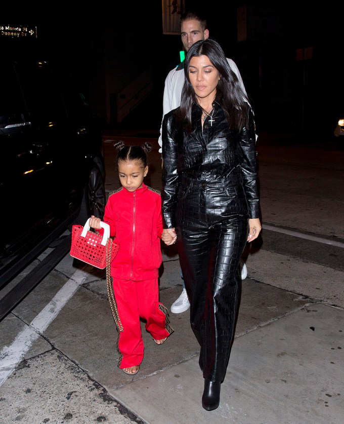 North West With Red Handbag