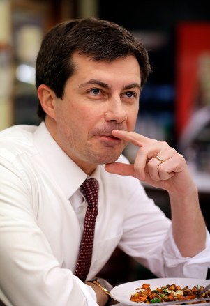 Mayor Pete Buttigieg listens to an AP reporter at Farmers Market in South Bend, Ind., . At 37, Pete Buttigieg is just a few years older than the minimum age required to serve as president of the United States
US Election 2020 Fresh Faces, South Bend, USA - 10 Jan 2019