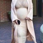 A pregnant Kim Kardashian goes to a medical building