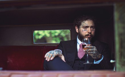 Rapper Post Malone has launched a rose wine range - inspired by his favourite tarot card. The tattooed hip-hop star teamed up with E & J Gallo Winery to unveil Maison No. 9. The collection combines 24-year-old Post's "love of the Mediterranean lifestyle and rosé". The wine, from Provence in France, is said to be "light, high quality" and "accessible". He said: "Rosé is for when you want to get a little fancy. “It’s a nice switch up and I have been thinking about doing my own wine for a while. "Maison No. 9 goes down smooth, and you’re all going to love it." Maison No 9 was created and developed in partnership with friend and entrepreneur James Morrissey of Global Brand Equities, and Dre London, long-time music manager and Founder of London Entertainment. Experimenting with an array of grape varietals and developing over fifty blends, the final mix is a 2019 Méditerranée IGP comprised of 45% Grenache Noir, 25% Cinsault, 15% Syrah, and 15% Merlot. The blend of varietals produces an identifiable soft, light “Provencal Pink” color that carries intense aromas of freshly picked fruit, such as ripe pineapple, pear and strawberry, underlined by sweet French desserts once uncorked. Maison No. 9 provides a clean, dry drinking experience with a balanced crisp finish and round texture, according to a press release. Inspired by Post’s favorite tarot card, the Nine of Swords which represents overcoming the daily challenges we all face, Maison No. 9 comes proudly in a sustainable all-glass packaging. The taller, sleeker extra flint bottle features an elongated neck and a custom solid glass closure. Designed in reference to battlements of a medieval castle near the vineyard, the unique fastening serves to help encourage re-use of the bottle. It will be available from June priced at $22, $45 and $90 USD respectively, Maison No. 9 will officially release in 750mL, 1.5mL and 3L. Mandatory credit Greg Reego/Maison No 9/MEGA Editorial usage only. 14 May 2020 Pictured: Po
