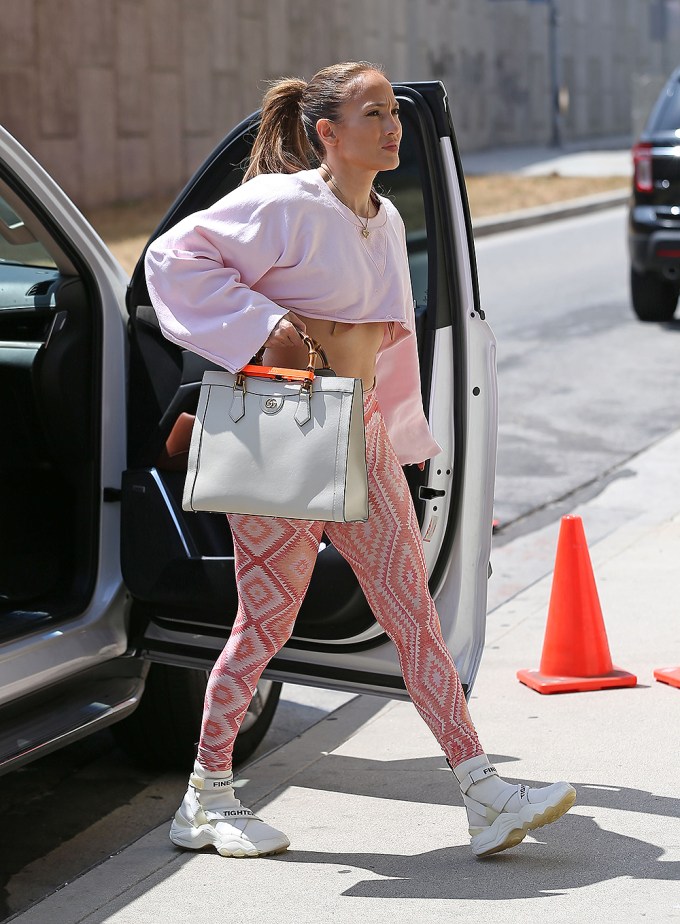 Jennifer Lopez's Gym Look Includes a Strappy Sports Bra and a Black Birkin