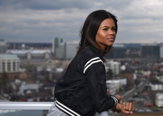 ADVANCE FOR WEEKEND EDITIONS MARCH 12-13 - In this Feb. 29, 2016 photo, Degree180 CEO Candace Owens poses overlooking the city from her home office in Stamford, Conn. Owens was bullied with racist threats as a student in high school and is now launching an anti-bullying website, Social Autopsy, which launches its beta version on Friday, March 4. (Tyler Sizemore/Hearst Connecticut Media) MANDATORY CREDIT Sizemore/Hearst Connecticut Media)