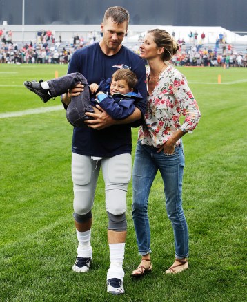 Tom Brady, Gisele Bundchen, Benjamin Brady New England Patriots quarterback Tom Brady carries his son Benjamin with his wife Gisele Bundchen at right after a joint workout with the Tampa Bay Buccaneers at NFL football training camp, in Foxborough, Mass Buccaneers Patriots Camp Football, Foxborough , USA