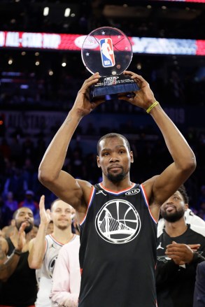 Team LeBron's Kevin Durant, of the Golden State Warriors holds his MVP trophy after the NBA All-Star basketball game, on Sunday, Feb. 17, 2019, in Charlotte, N.C. The Team LeBron won 178-164. (AP Photo/Chuck Burton)