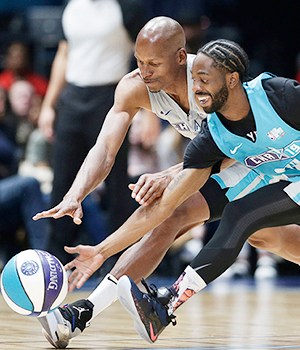 Home team's Famous Los, right, and Away team's Ray Allen chase the ball during the first half of an NBA All-Star Celebrity basketball game in Charlotte, N.C., Friday, Feb. 15, 2019. (AP Photo/Gerry Broome)