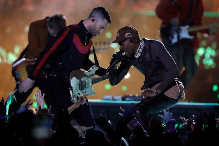 Adam Levine of Maroon 5, left, and Travis Scott perform during halftime of the NFL Super Bowl 53 football game between the Los Angeles Rams and the New England Patriots Sunday, Feb. 3, 2019, in Atlanta. (AP Photo/Jeff Roberson)