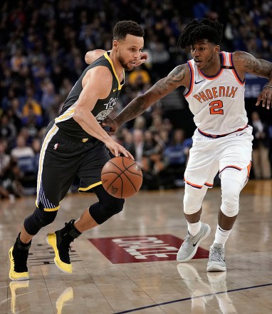 Stephen Curry and Elfrid PaytonPhoenix Suns at Golden State Warriors, Oakland, USA - 12 Feb 2018Golden State Warriors guard Stephen Curry (L) drives past Phoenix Suns guard Elfrid Payton (R) during the first half of their NBA game at Oracle Arena in Oakland, California, USA, 12 February 2018.