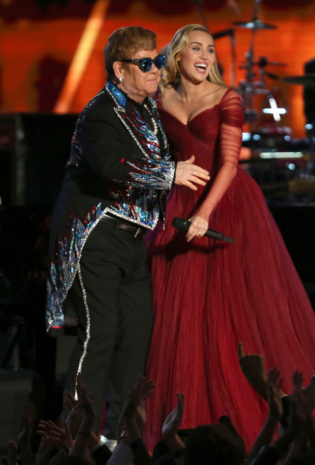 Elton John, Miley Cyrus. Elton John and Miley Cyrus perform "Tiny Dancer" at the 60th annual Grammy Awards at Madison Square Garden, in New York60th Annual Grammy Awards - Show, New York, USA - 28 Jan 2018