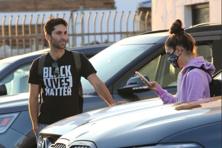 Los Angeles, CA  - Nev Schulman and Jenna Johnson relax in the parking lot and chat with Monica Aldama before going over some moves with Sasha Farber.  Nev makes a political statement wearing Black Lives Matter shirt.Pictured: Nev Schulman , Jenna JohnsonBACKGRID USA 24 SEPTEMBER 2020 BYLINE MUST READ: Phamous / BACKGRIDUSA: +1 310 798 9111 / usasales@backgrid.comUK: +44 208 344 2007 / uksales@backgrid.com*UK Clients - Pictures Containing ChildrenPlease Pixelate Face Prior To Publication*