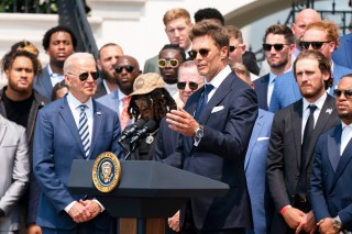 President Joe Biden listens to Tampa Bay Buccaneers quarterback Tom Brady speak during a ceremony on the South Lawn of the White House, in Washington, where the president honored the Super Bowl Champion Tampa Bay Buccaneers for their Super Bowl LV victoryBiden Buccaneers Football, Washington, United States - 20 Jul 2021