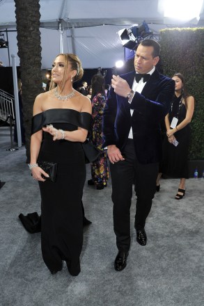 Jennifer Lopez, left, and Alex Rodriguez arrive at the 26th annual Screen Actors Guild Awards at the Shrine Auditorium & Expo Hall on Sunday, Jan. 19, 2020, in Los Angeles. (Photo by Richard Shotwell/Invision/AP)
