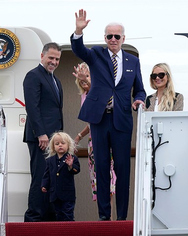President Joe Biden, center, waves as he is joined by, from left, son Hunter Biden, grandson Beau Biden, first lady Jill Biden, and daughter-in-law Melissa Cohen, as they stand at the top of the steps of Air Force One at Andrews Air Force Base, Md., . They are heading to South Carolina for a week-long vacation on Kiawah Island
Biden, Andrews Air Force Base, United States - 10 Aug 2022