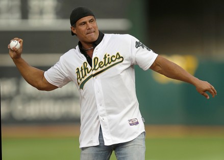 Jose Canseco Former Oakland Athletics player Jose Canseco throws out the ceremonial first pitch prior to a baseball game against the Boston Red Sox, in Oakland, Calif
Boston Red Sox v Oakland Athletics, MLB baseball game, Oakland, USA - 03 Sep 2016