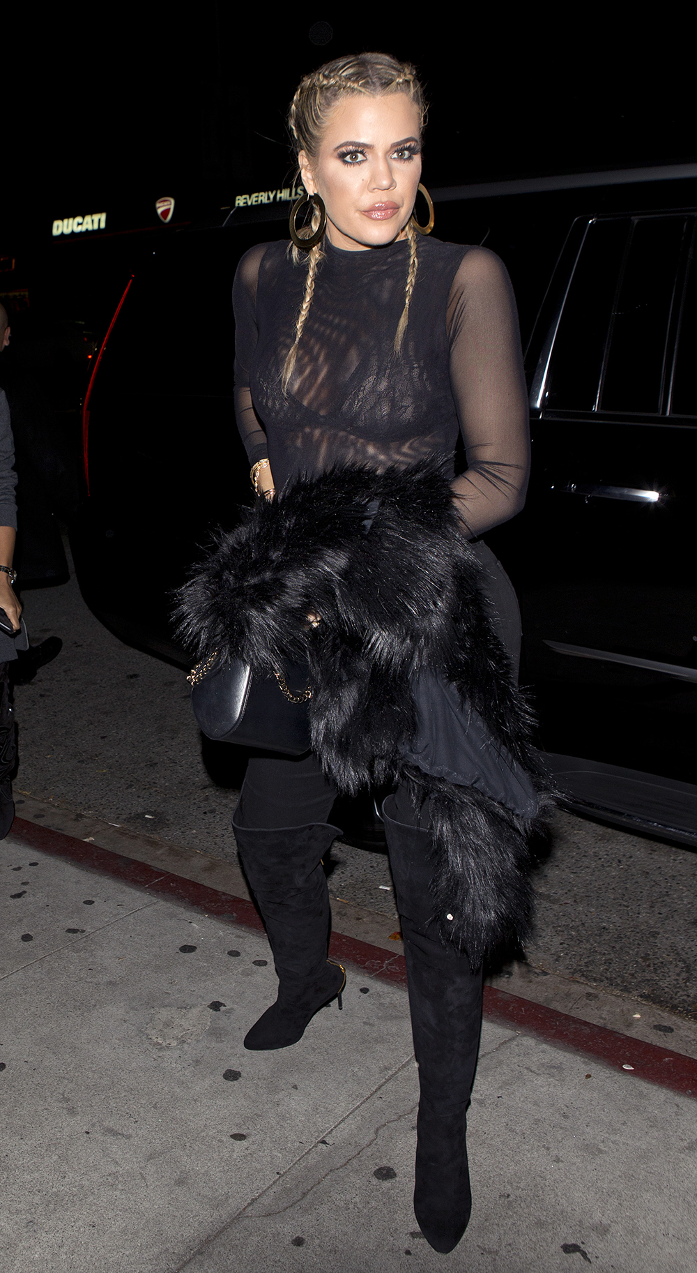 Khloe Kardashian with braided hair and wearing a sheer top was seen arriving at 'The Nice Guy' bar in West hollywood, CA