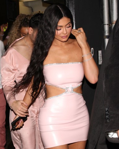 Kylie Jenner and her crew are color coordinated as they leave the Nice Guy restaurant in West Hollywood. Kylie is wearing a tight pink leather dress. Earlier in the evening, Kylie was at Goya Studios celebrating the launch of her new skincare product with her sisters and mother as well. 22 May 2019 Pictured: Kylie Jenner. Photo credit: Photographer Group/MEGA TheMegaAgency.com +1 888 505 6342 (Mega Agency TagID: MEGA426522_002.jpg) [Photo via Mega Agency]