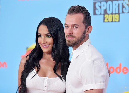 Nikki Bella, left, and Artem Chigvintsev arrive at the Kids' Choice Sports Awards on Thursday, July 11, 2019, at the Barker Hangar in Santa Monica, Calif. (Photo by Richard Shotwell/Invision/AP)