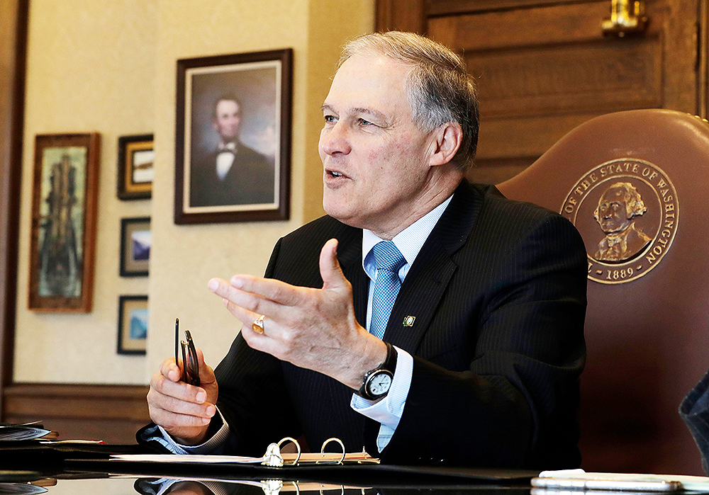 Washington Gov. Jay Inslee speaks during a morning meeting with staff members in his office, at the Capitol in Olympia, Wash
Washington Gov Jay Inslee, Olympia, USA - 27 Feb 2019